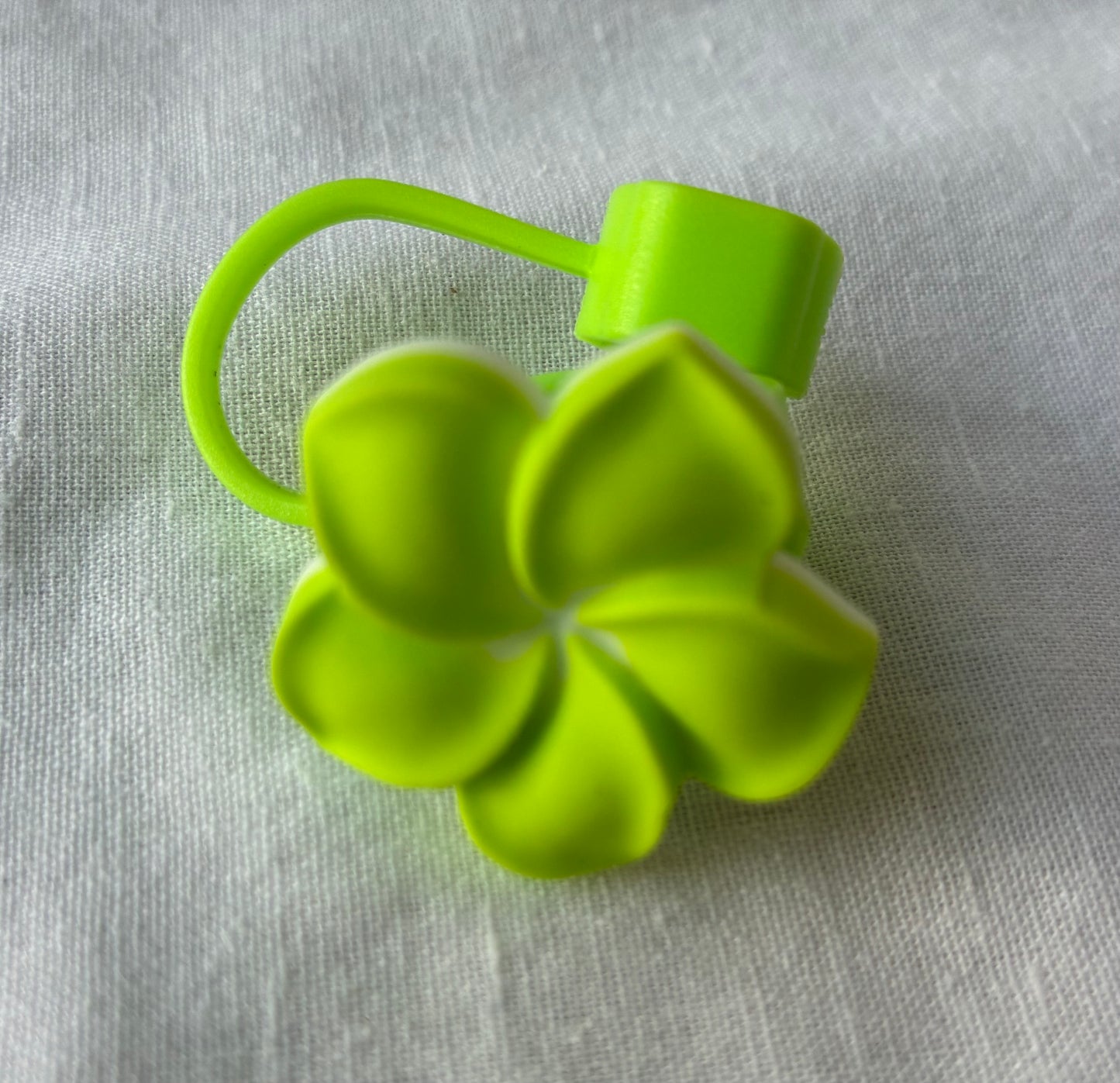 Bright green frangipani straw topper