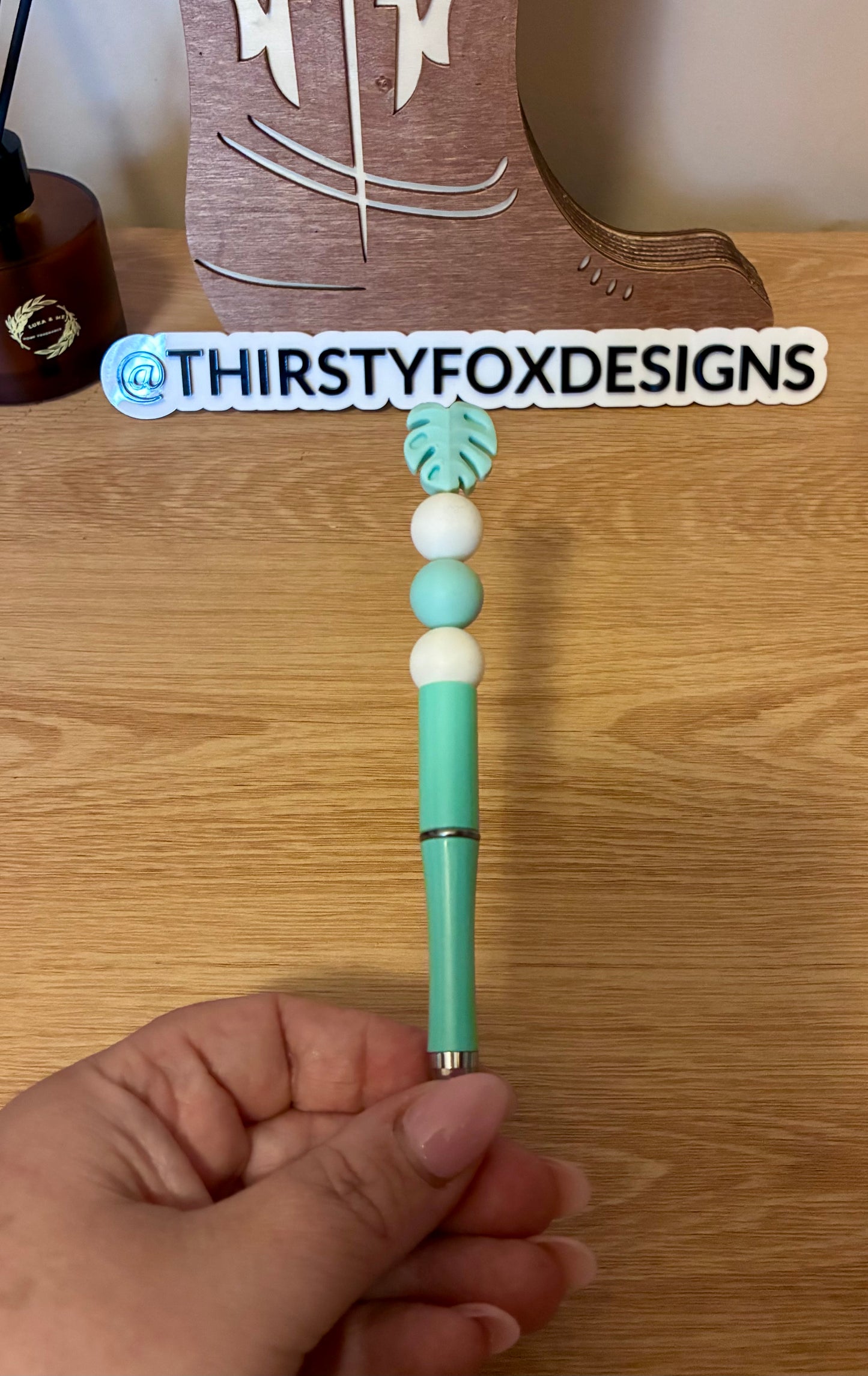 White & green monstera beaded pen