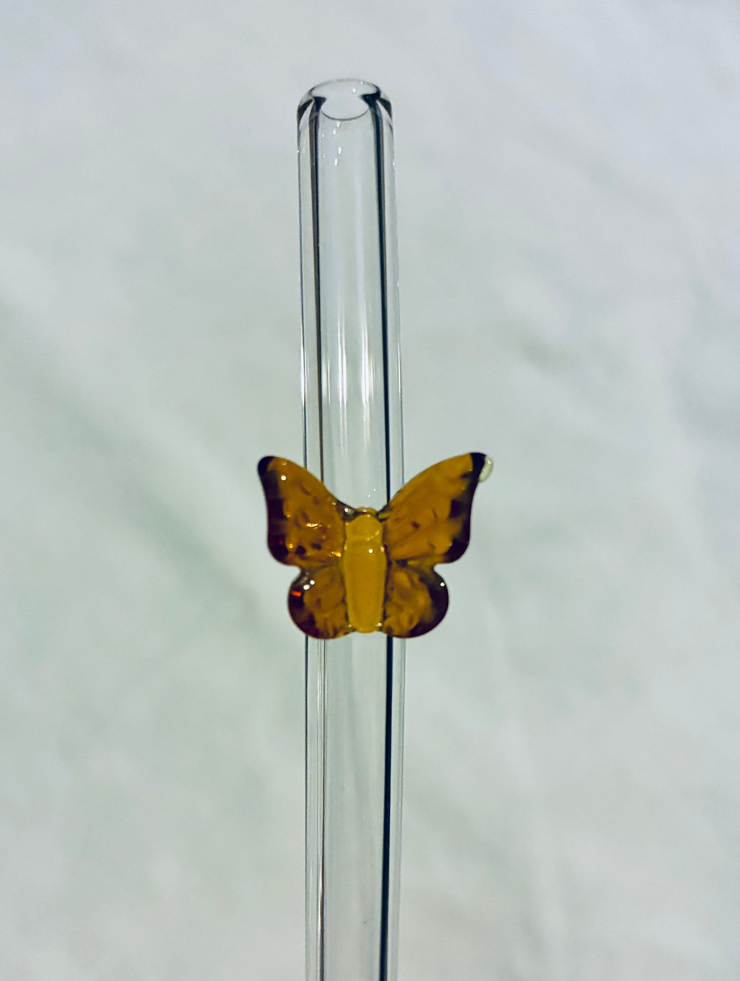 Orange/amber glass butterfly straw