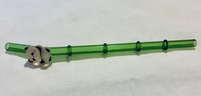 Glass panda on bamboo straw