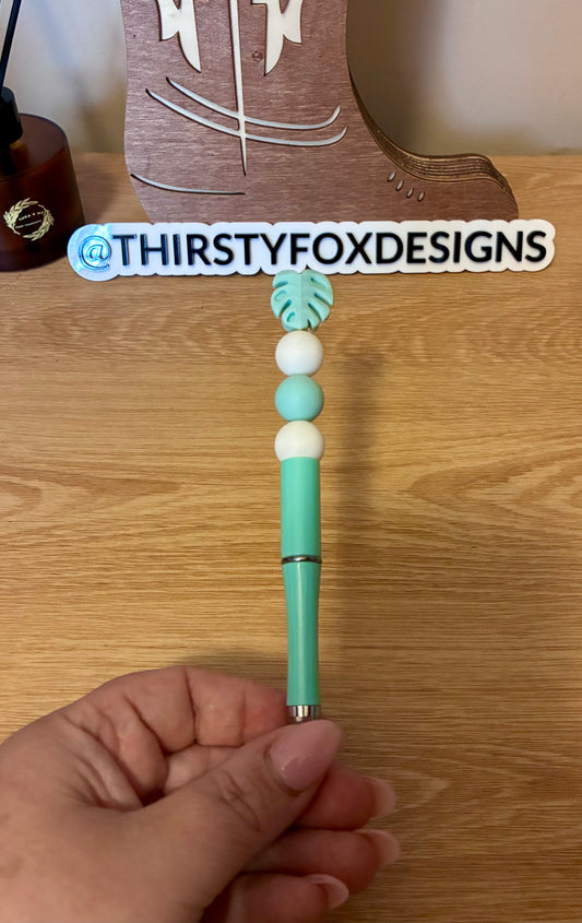 White & green monstera beaded pen